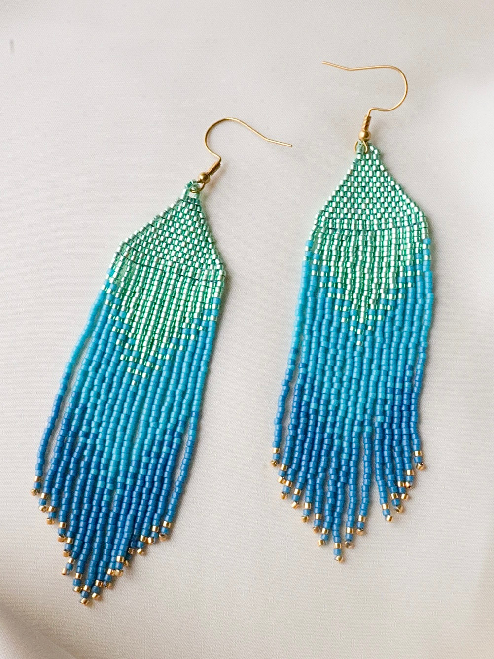 Handmade long fringe earrings with premium turquoise and ocean blue seed beads, elegant lightweight jewelry with a fresh ocean vibe